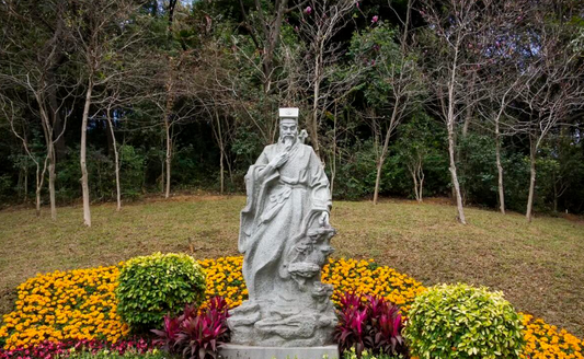 On what grounds does Lü Dongbin hold a status in Taoism second only to the Supreme Old Lord?