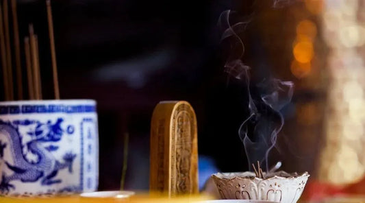 Taoist priest performing incense visualization ritual before a sacred altar