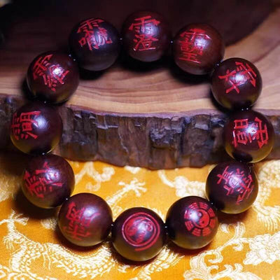Bracelet de perles taoïstes en bois de jujubier et cinabre, orné d'un caractère interdit, frappé par la foudre.